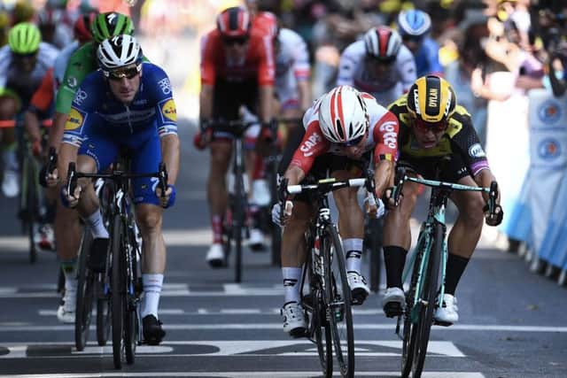 Caleb Ewan, centre, beats Dylan Groenewegen, right, and Elia Viviani, left, to the line in Toulouse. Picture: Anne-Christine Poujoulat/AFP/Getty
