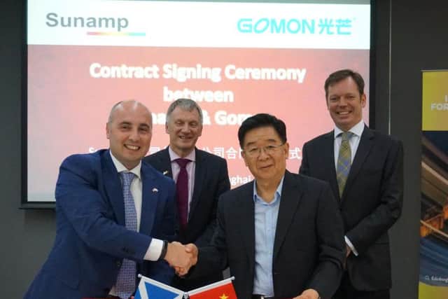 From left: Sunamp's Maurizio Zaglio with Scottish Trade Minister Ivan McKee and Chaohong Fan, chairman of Gomon, at the signing of the MoU. Picture: Contributed