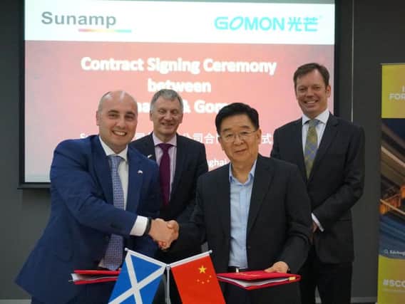 From left: Sunamp's Maurizio Zaglio with Scottish Trade Minister Ivan McKee and Chaohong Fan, chairman of Gomon, at the signing of the MoU. Picture: Contributed