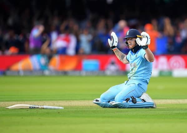 Ben Stokes holds his hands up after the ball, thrown by a fielder as he ran for the crease, hit his bat, then went out for four runs in the World Cup final against New Zealand (Picture: Clive Mason/Getty Images)
