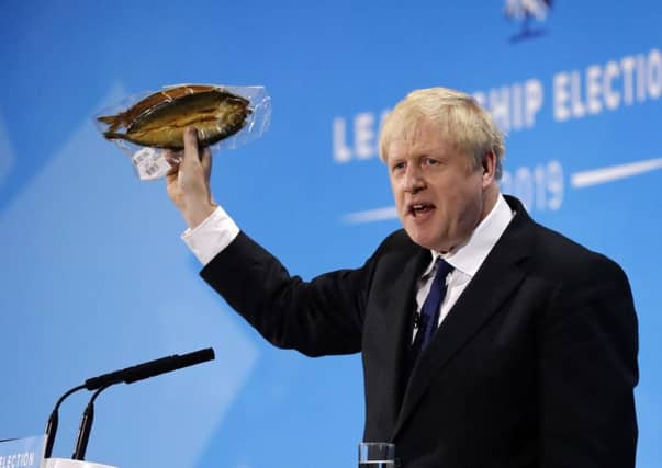 Forget the recession and spiralling public debt caused by a no-deal Brexit, Boris Johnson has a probably inaccurate point to make about a kipper (Picture: Tolga Akmen/AFP/Getty)