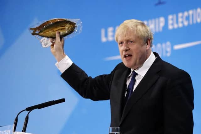 Forget the recession and spiralling public debt caused by a no-deal Brexit, Boris Johnson has a probably inaccurate point to make about a kipper (Picture: Tolga Akmen/AFP/Getty)