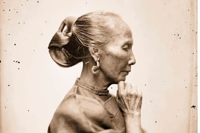 An old Cantonese woman photographed by Thomson in Guangzhou, Guangdong, around
1868