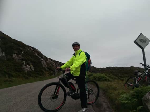 Alastair Dalton tries out an Assynt Development Trust electric bike on the North Coast 500 north of Lochinver. Picture: The Scotsman