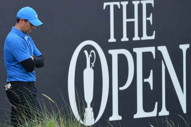 Rory McIlroy cuts a dejected figure at the 18th hole. Picture: Stuart Franklin/Getty Images