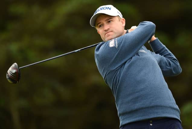 Russell Knox tees off on the fifth hole during the first round of the Open Championships at Royal Portrush. Picture: AFP/Getty