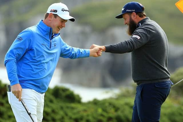 A fist bump between Bob McIntyre, left, and Andew 'Beef' Johnston. Picture: Mike Ehrmann/Getty