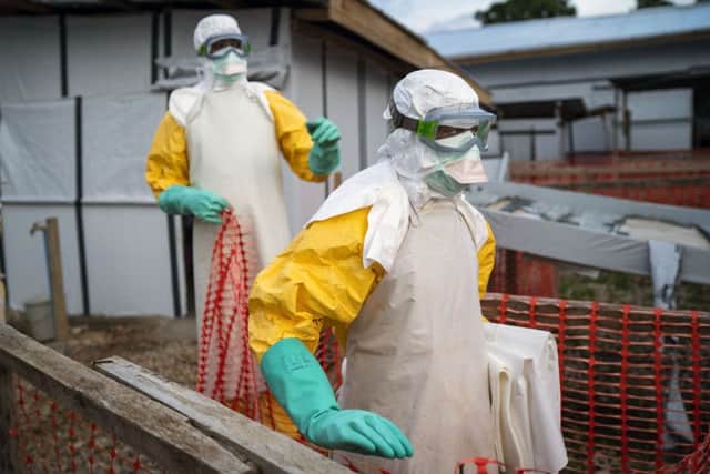 Health workers tackling the Ebola outbreak at a treatment centre in the Democratic Republic of Congo