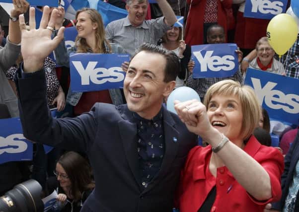 Alan Cumming and Nicola Sturgeon at a flash mob meeting in Glasgow in September 2014 (Picture: Robert Perry)