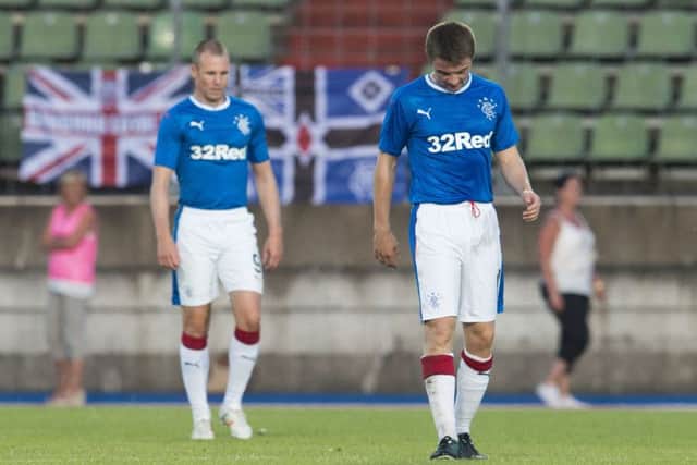 Jordan Rossiter, right, and Kenny Miller cut dejected figures during Rangers' defeat by Progres in 2017. Picture: SNS