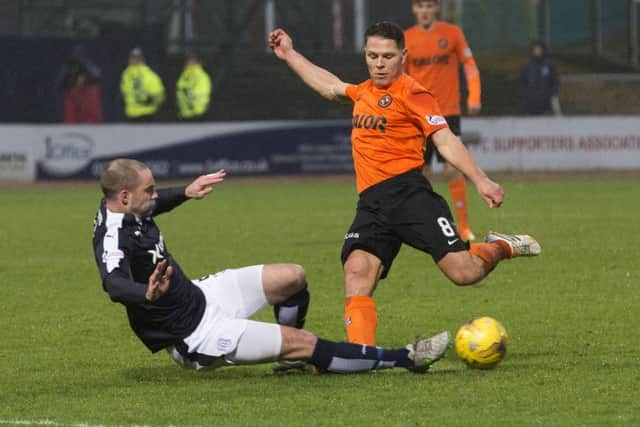 James McPake tackles John Rankin in the January 2016 Dundee derby which led to his horror knee injury. Picture: SNS