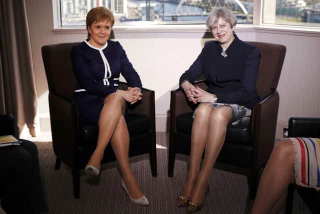 Nicola Sturgeon with May at Glasgow's Crowne Plaza hotel. Picture: Russell Cheyne/PA
