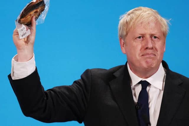 Johnson holds up the kipper at the final hustings of the Conservative leadership campaign at ExCeL London. Picture: 
Dan Kitwood/Getty