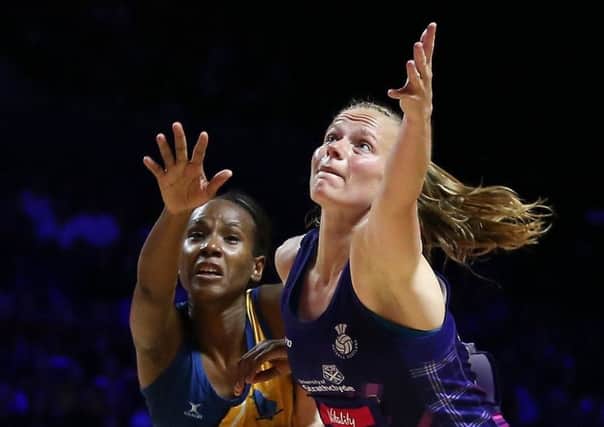Scotland's Claire Maxwell, right, with Barbados' Tonisha Rock-Yaw. Picture: Nigel French/PA Wire