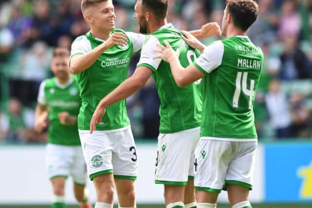 Christian Doidge, centre, celebrates after scoring his first goal for Hibs.