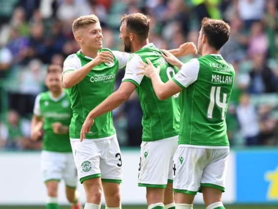 Christian Doidge, centre, celebrates after scoring his first goal for Hibs.