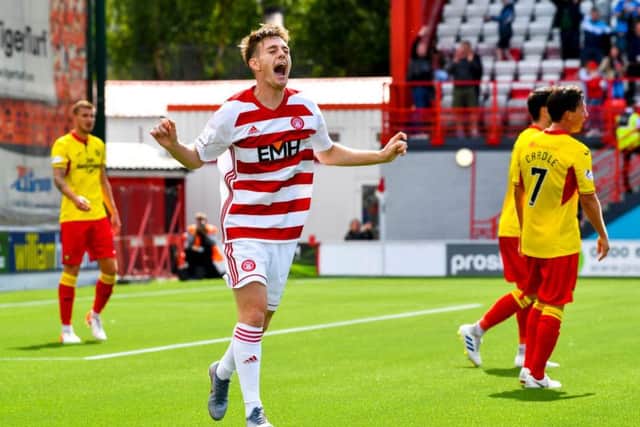 Ross Cunningham celebrates after scoring to make it 2-1 to Accies.