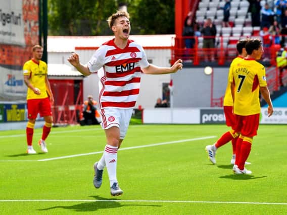 Ross Cunningham celebrates after scoring to make it 2-1 to Accies.