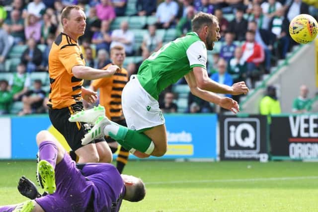 Neil Parry was injured trying to stop Christopher Doidge from opening the scoring for Hibs.