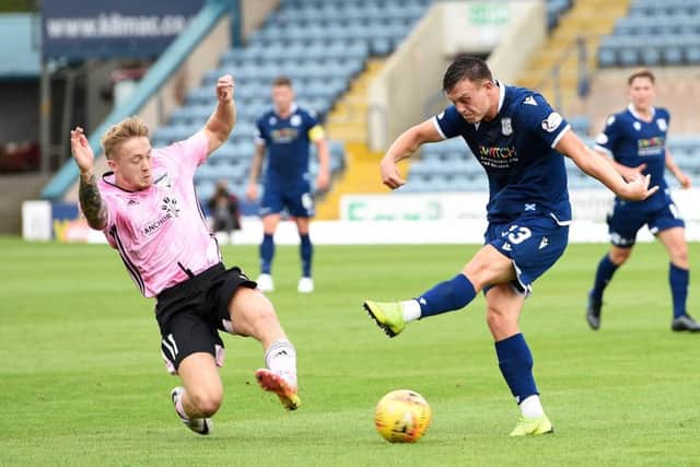 Aidan Smith blocks a shot from Dundee's Jordan Marshall. Picture: SNS