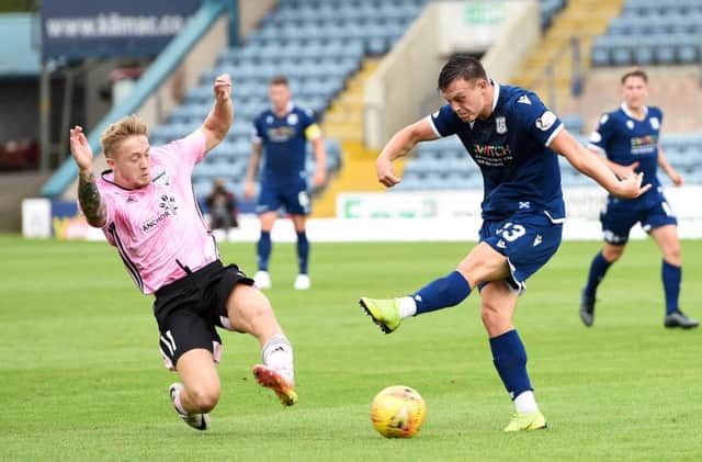 Aidan Smith blocks a shot from Dundee's Jordan Marshall. Picture: SNS