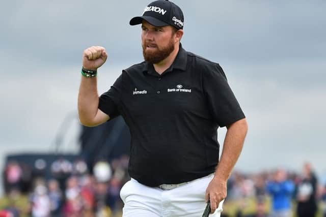 Open leader Shane Lowry celebrates a putt on the 15th hole. Picture: Glyn Kirk/AFP/Getty Images