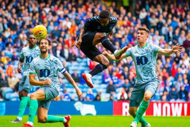 Jermain Defoe gets on the end of Jordan Jones' cross to put Rangers in front