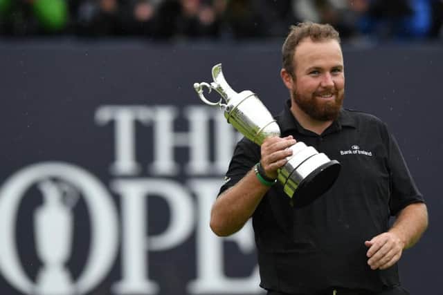 Shane Lowry celebrates winning the 148th Open at Royal Portrush