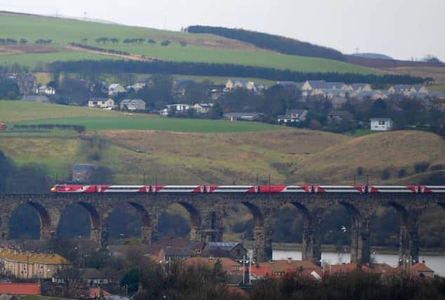 A Virgin train makes its way over the Royal Border Bridge on the east coast main line, south of Berwick station