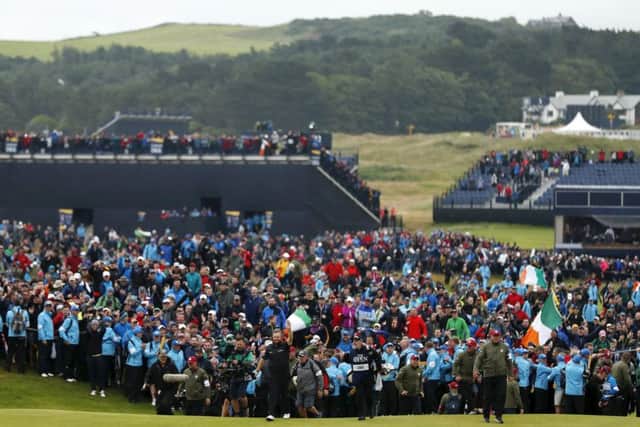 The huge crowd which watched Shane Lowry win this year's Open Championship at Royal Portrush may lead the R&A to consider dropping venues which have attracted lower attendances. Picture: Getty.