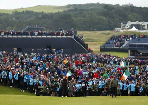 The huge crowd which watched Shane Lowry win this year's Open Championship at Royal Portrush may lead the R&A to consider dropping venues which have attracted lower attendances. Picture: Getty.