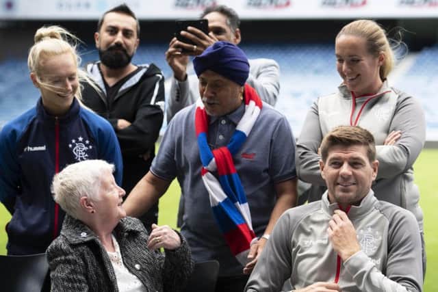 Rangers manager Steven Gerrard, right, gets involved in the clubs Everyone Anyone initiative.