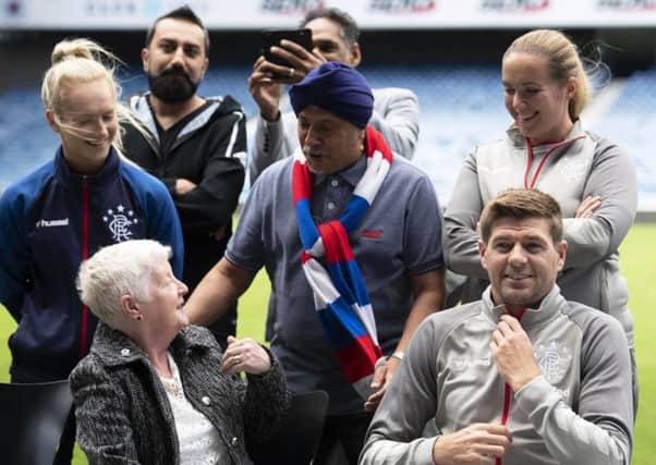 Rangers manager Steven Gerrard, right, gets involved in the clubs Everyone Anyone initiative.