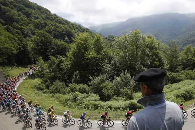 A Basque fan watches the peloton on the slopes of the Col du Tourmalet. Picture: Christophe Ena/AP