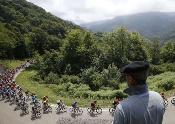 A Basque fan watches the peloton on the slopes of the Col du Tourmalet. Picture: Christophe Ena/AP