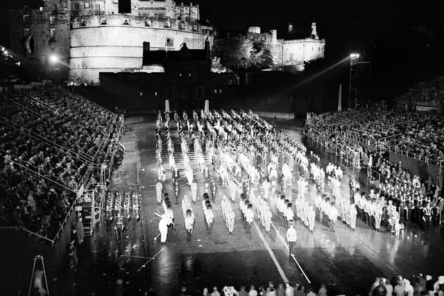 Grand finale of the Edinburgh Tattoo in 1961 - a floodlit Edinburgh Castle and battlements.