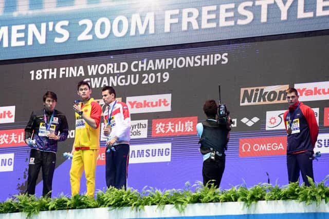 Duncan Scott, right, refuses to acknowledge Sun Yang after his 200m freestyle victory