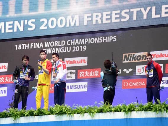 Duncan Scott, right, refuses to acknowledge Sun Yang after his 200m freestyle victory
