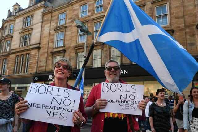 Pro-independence supporters stages an 'anti-Boris' rally in Glasgow yesterday