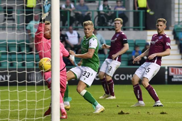 Fraser Murray scores in the 87th minute to complete Hibs' 3-0 win.