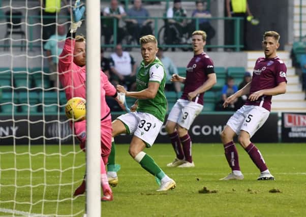 Fraser Murray scores in the 87th minute to complete Hibs' 3-0 win.