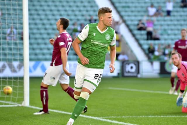 Florian Kamberi celebrates scoring his early opener for Hibs against Arbroath. Picture: SNS.