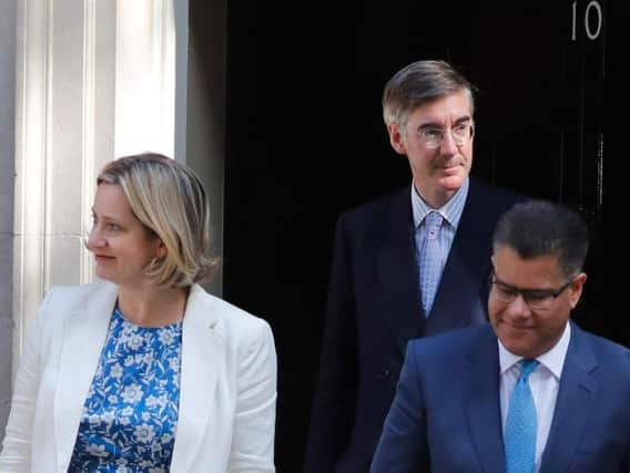 Britain's Work and Pensions Secretary Amber Rudd, Britain's Leader of the House of Commons Jacob Rees-Mogg and Britain's International Development Secretary Alok Sharma leave 10 Downing street. (Photo by Tolga Akmen/ AFP)