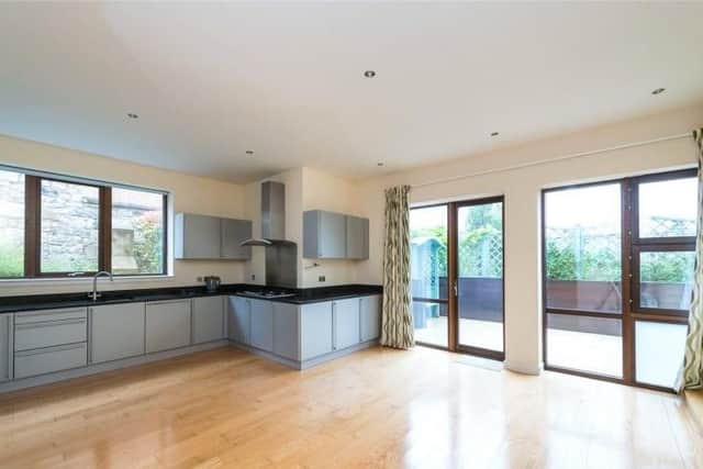 The modern kitchen - with American style fridge - also has access to a terrace.