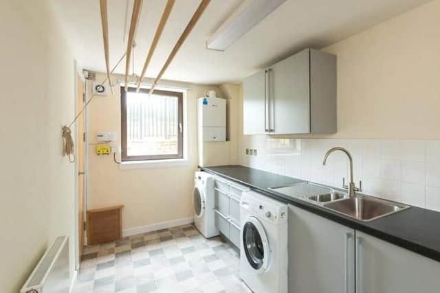 There is a handy utility room off the kitchen.