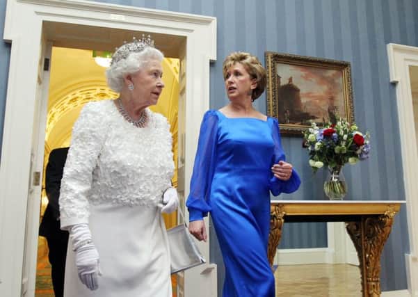 Queen Elizabeth and then Irish President Mary McAleese arrive for a state dinner at Dublin Castle in 2011 (Picture: Irish Government/Pool/Getty Images)