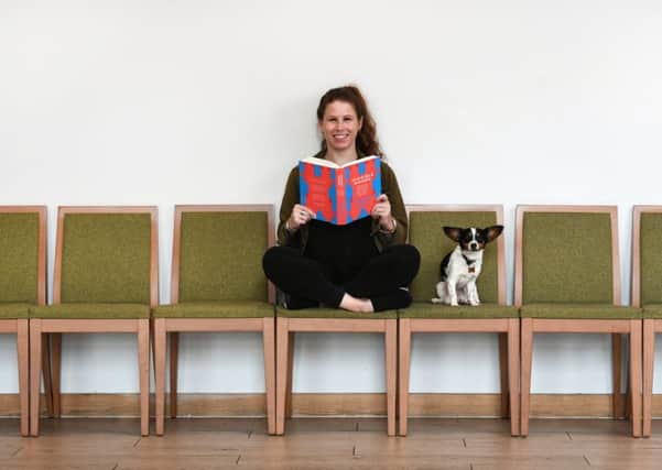 Caroline Criado Perez with her new book, Invisible Women: Exposing Data Bias in a World Designed For Men, and her dog Poppy.  Picture: John Devlin