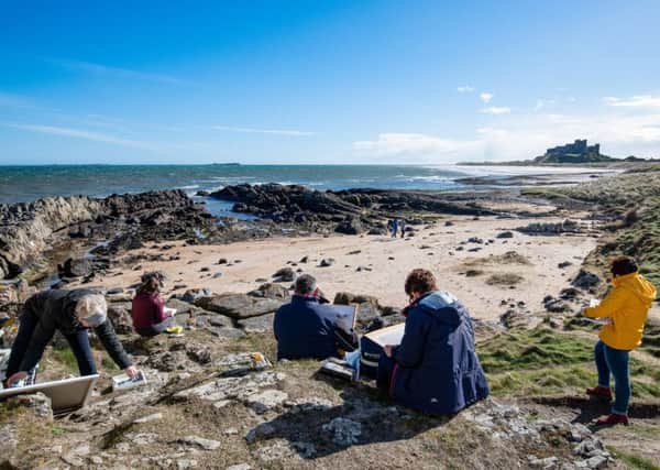 Sketching on the beach in front of Bamburgh Castle. Picture: Julie Gregory