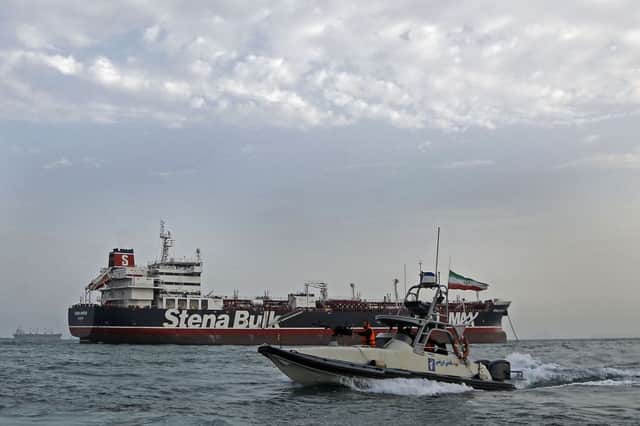 Iranian Revolutionary Guards patrolling the Glasgow-managed tanker Stena Impero after its seizure in the Strait of Hormuz. Picture: Hasan Shirvani/Mizan News Agency
