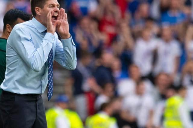Steven Gerrard bellows instructions to his Rangers players from the sidelines.